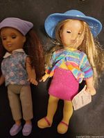 Front view of both dolls showing outfits and facial features