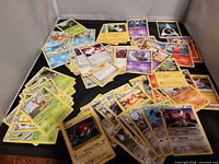 Spread of assorted Pokémon cards showing variety and wear