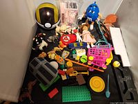 Overview of assorted toys and parts on tabletop