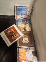 Overall view of five sealed CDs in lot