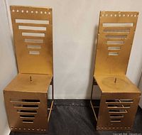 Front view of both gold metal throne chair candleholders