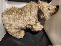 Side profile of plush bear on all fours