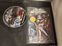 PS2 Star Wars Battlefront II disc and manual overall view