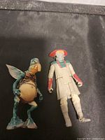 Front view of Watto and Constable Zuvio action figures placed on black surface