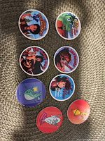 Eight milk caps laid out front view