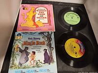 Front view showing both Disney book-and-record sets with vinyl discs