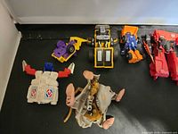 Overview of mixed transforming toys on black surface