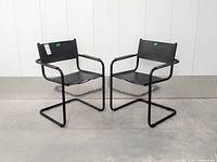 Pair of black Bauhaus cantilever armchairs front view