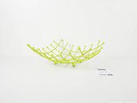 Side view showing concave lattice structure and ball feet