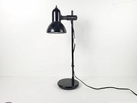 Full view of lamp off showing base, post, arm and cord