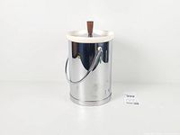 Full view of ice bucket front showing chrome body, handle, lid