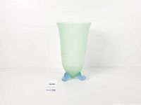 Full view of Murano-style vase showing seafoam green body and blue feet