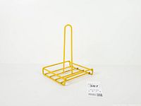 angled view showing entire yellow wire paper towel holder