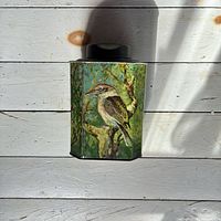 Front view showing kookaburra illustration on tin