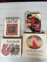 Overhead view of four Canadian art books