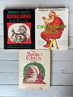 Front covers of the three Christmas books