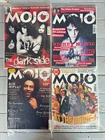 Four Mojo magazines in sleeves: The Doors (The Dark Side), White Stripes, Bob Marley, At The Movies