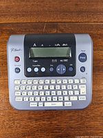 Front view of Brother P-touch PT-1830 label maker showing keyboard and display