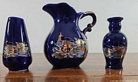 Group shot of cobalt blue miniature pitcher and two vases