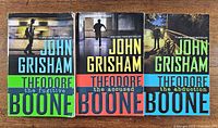 Front covers of all three Theodore Boone paperbacks