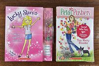 Front covers of both books and packaged charm bracelet