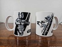 Front view of both mugs showing Stormtrooper graphic and Star Wars logo