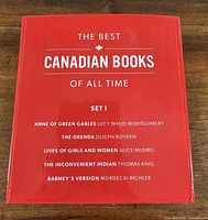 Front of red slipcase listing titles