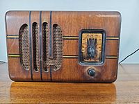 Front view of Viking wooden tube radio showing grille, dial, knob