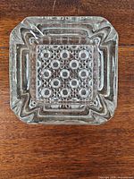 Top view showing square stepped rim and geometric patterned base