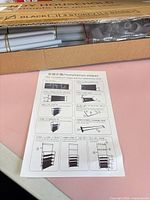 Box containing disassembled metal tubes and instruction sheet