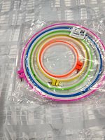 Sealed package showing all six nested multicolor hoops