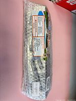 Full view of sealed bubble-wrapped grill heat deflectors showing retail card