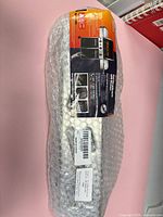 sealed package showing four stacked stainless deflectors