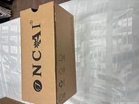Closed shoe box showing ONCAI branding
