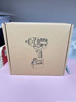 Sealed cardboard box showing line art of cordless impact wrench