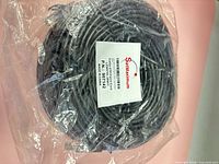 Full view of coiled cable in sealed plastic with SatMaximum label