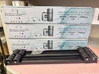 Three retail boxes labelled model BN-16 stacked with one assembled base in front