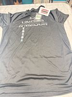 Full view of front of T-shirt with tags attached