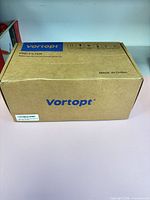 Sealed Vortopt cardboard box labeled pre-filter