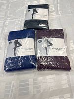 All three packs of tights showing colors and packaging