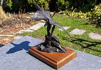 front-right view of bronze pheasants sculpture on wood base