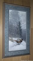 Framed print hanging vertically showing full artwork and frame