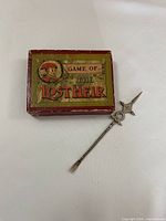 Closed box of Game of the Lost Heir and pickle fork