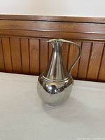 Side view of Metropolitan Museum of Art pewter pitcher