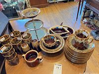 Full dinnerware set arranged on table showing quantity and variety