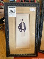 Front view of first framed print showing illustration, mat and frame