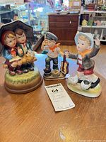 All three ceramic children figurines displayed together