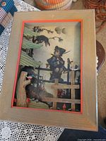 Front view of framed 3D shadow box artwork