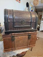 Both chests stacked: shows size difference, finishes, and hardware