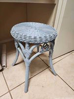 Full view of light blue wicker vanity stool